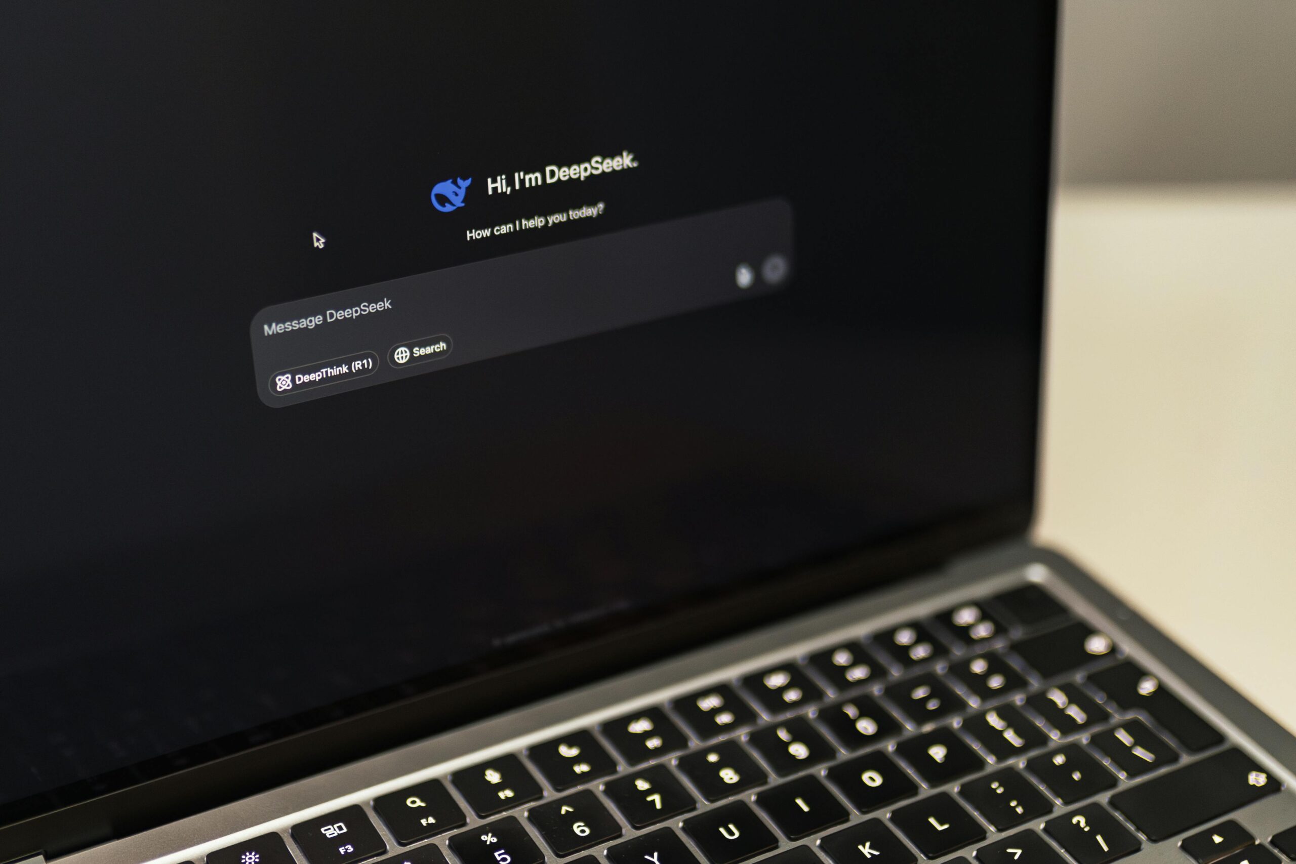 A MacBook displaying the DeepSeek AI interface, showcasing digital innovation.